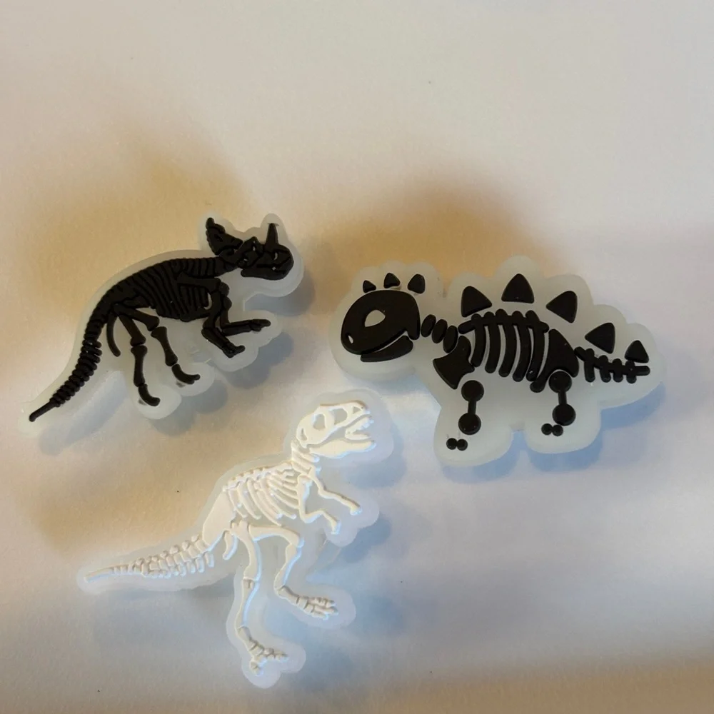 Glow in the dark crocs charms dinosaurs